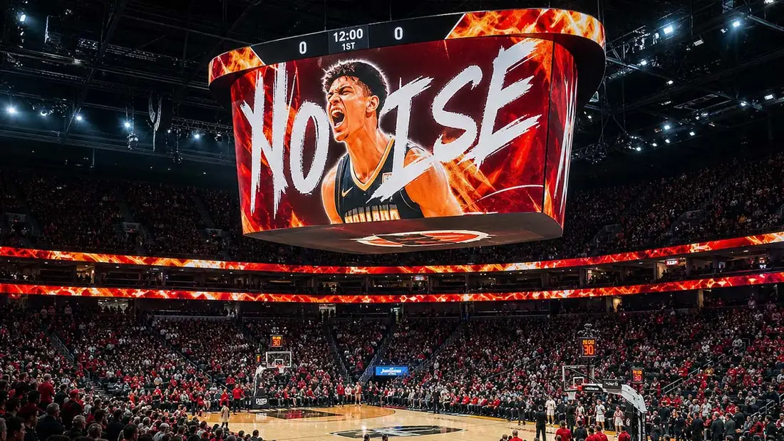 Center-hung LED scoreboard over a packed basketball arena