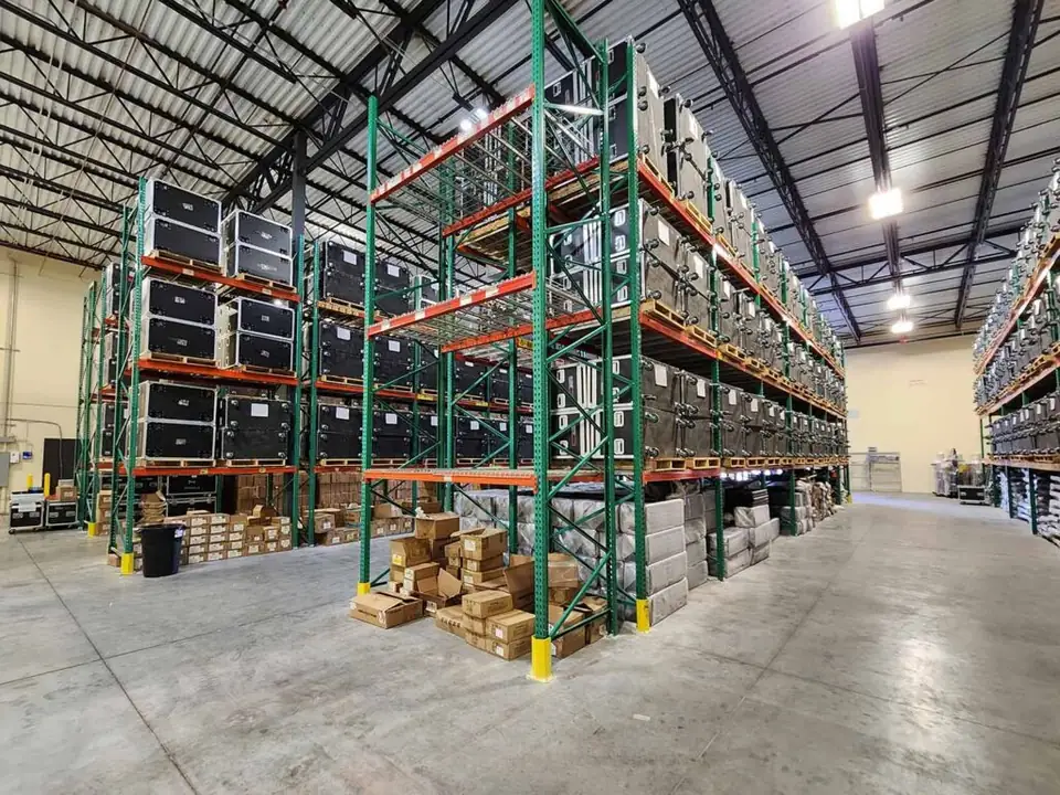 Warehouse aisles stocked with LED panel road cases in Florida